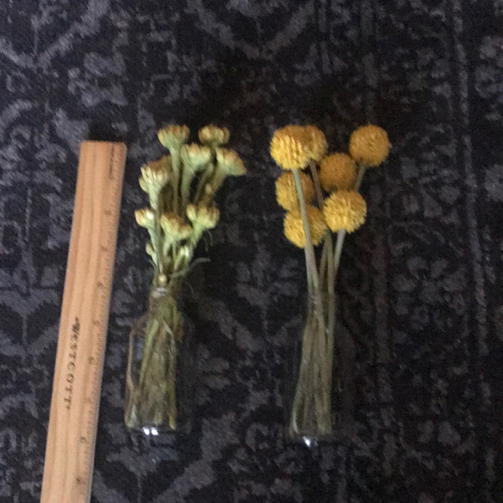 Small non plastic flowers in vases